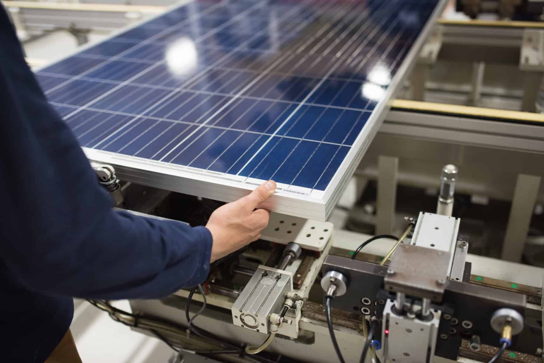 Production Of Solar Panels, Man Working In Factory.